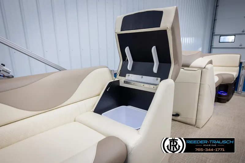 Slide: The Image of 2025 Avalon LSZ VRB boat interior with open storage compartment, beige and cream seating. - 23