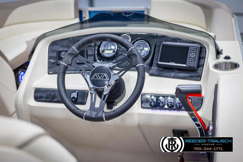 Slide: The Image of 2025 Avalon LSZ VRB boat dashboard with steering wheel and control panel. - 29