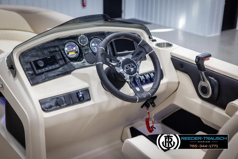 Slide: The Image of 2025 Avalon LSZ VRB boat dashboard with steering wheel and control panel. - 30