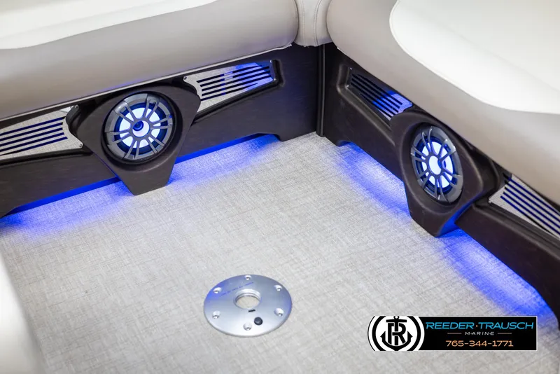 Slide: The Image of 2025 Avalon LSZ VRB boat interior with blue LED lighting and speakers. - 44