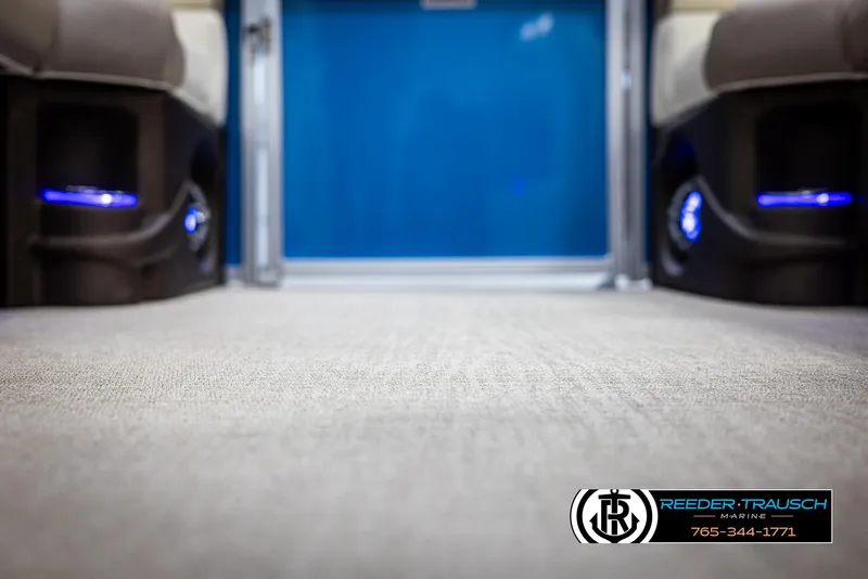 Slide: The Image of Interior view of 2025 Avalon LSZ VRB with blue LED lighting and carpeted flooring. - 47