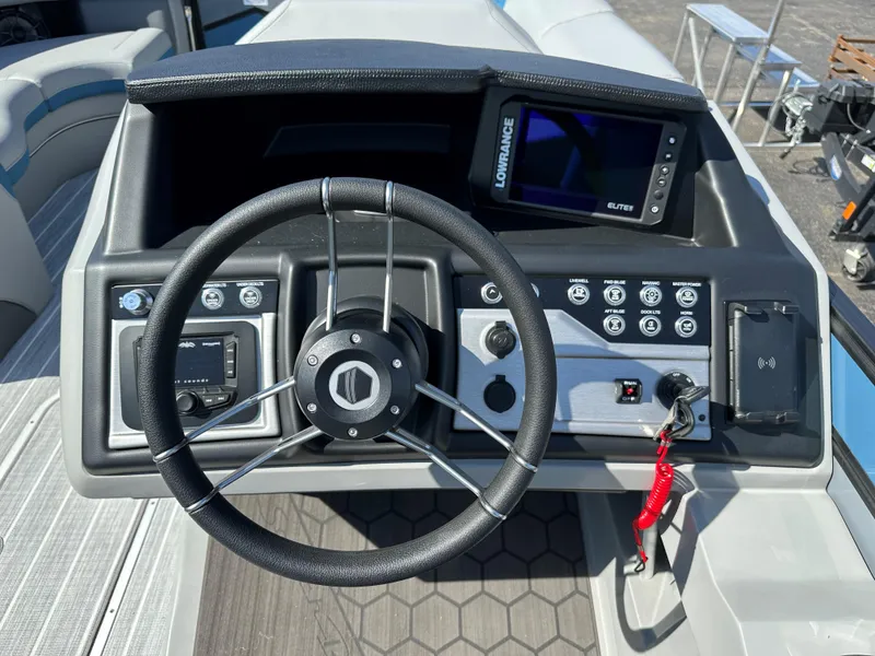 Slide: The Image of Steering console of 2025 South Bay 523 ULE boat with navigation controls. - 11