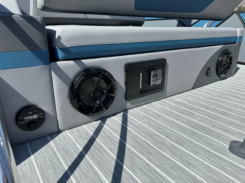 Slide: The Image of 2025 South Bay 523 ULE boat interior with speakers and striped flooring. - 14
