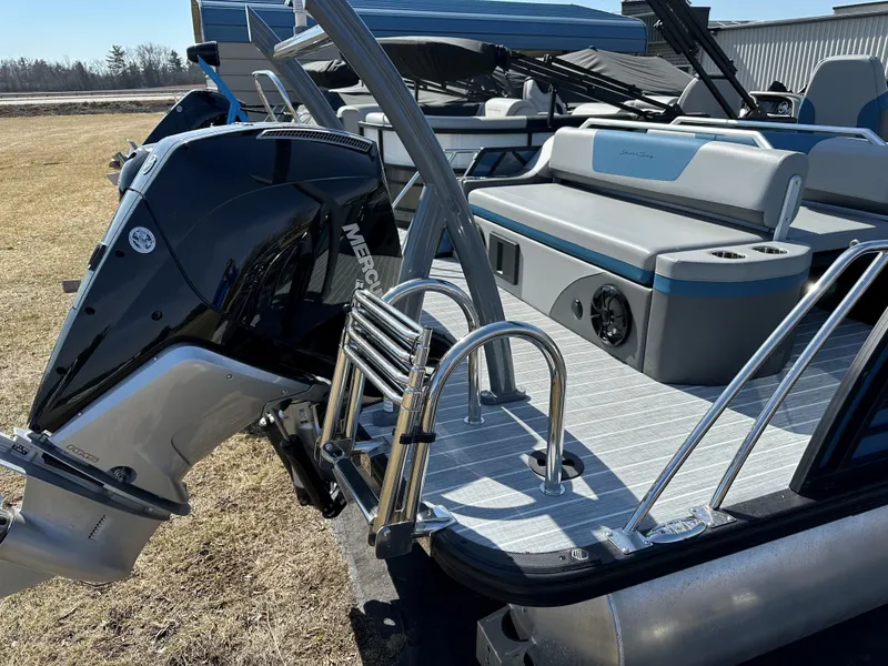 Slide: The Image of 2025 South Bay 523 ULE pontoon boat with Mercury outboard motor and swim ladder. - 3