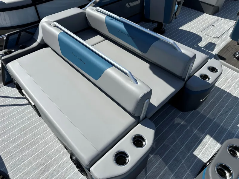 Slide: The Image of Luxury seating on 2025 South Bay 523 ULE boat with cup holders and sleek design. - 7