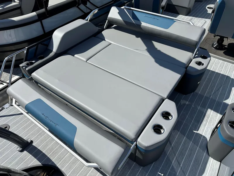 Slide: The Image of 2025 South Bay 523 ULE boat seating with gray upholstery and integrated cup holders. - 8