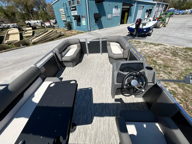 Slide: The Image of Interior view of 2025 Armada Z-168 pontoon boat with seating and steering wheel. - 11