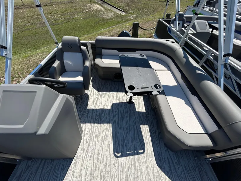 Slide: The Image of 2025 Armada Z-168 boat interior with gray seating and table on deck. - 6