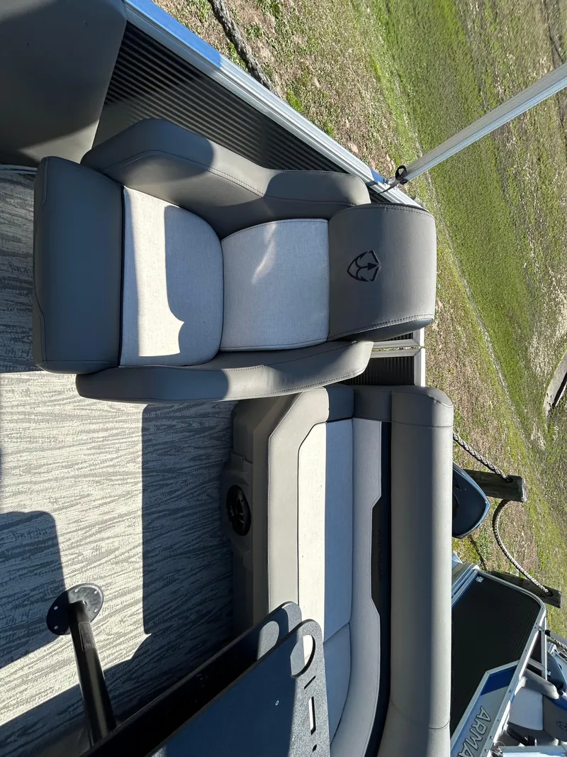 Slide: The Image of Armada Z-168 2025 boat interior with gray and white seating on a sunny day. - 9