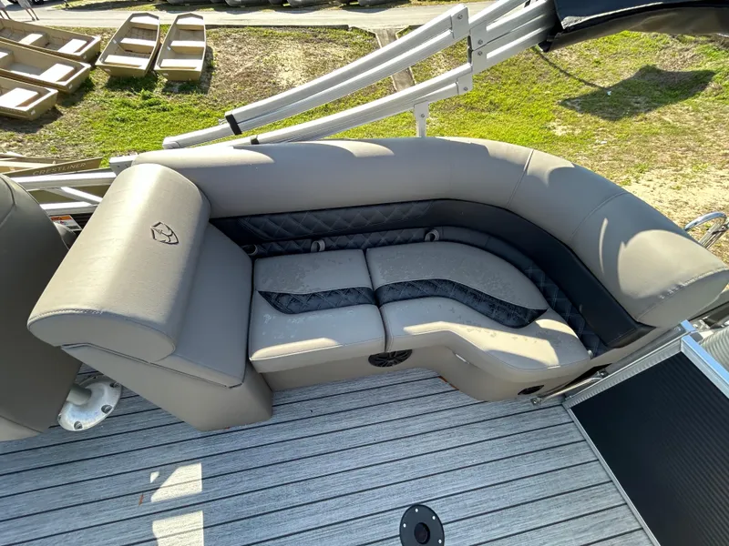Slide: The Image of Luxurious seating on 2025 Armada Drakkar 23QL boat, featuring sleek gray upholstery. - 13