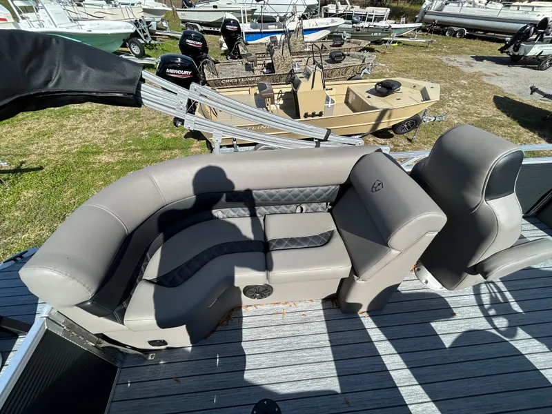 Slide: The Image of 2025 Armada Drakkar 23QL boat interior with gray seating and black accents. - 17