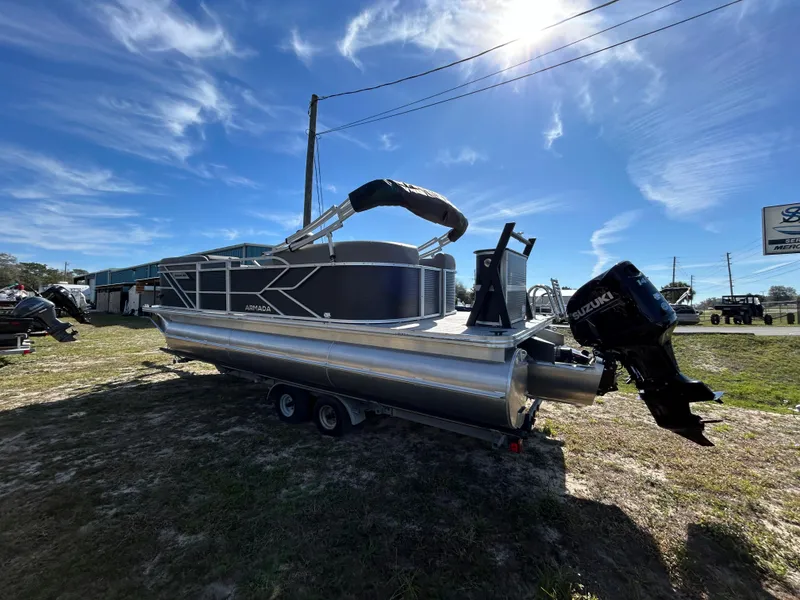 Slide: The Image of 2025 Armada Drakkar 23QL pontoon boat on trailer under clear blue sky. - 4
