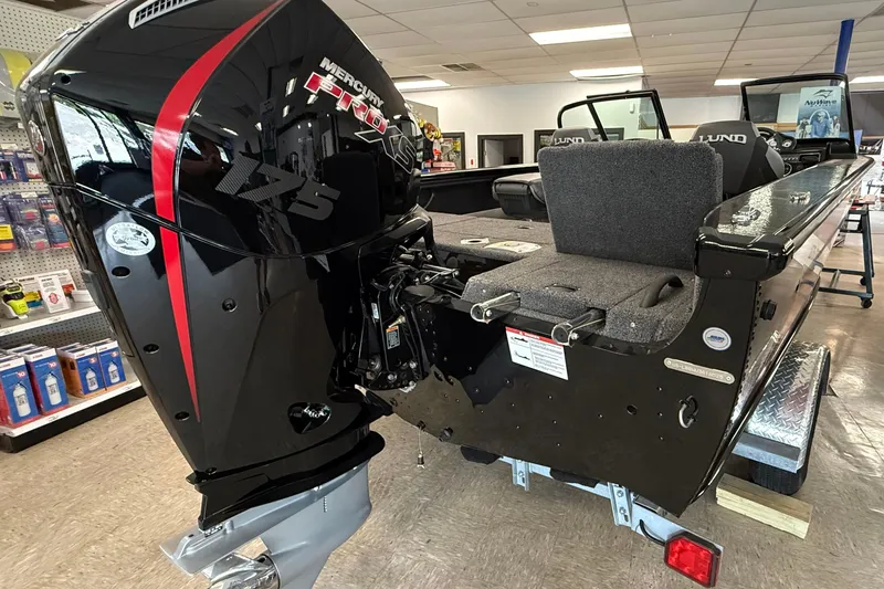 Slide: The Image of 2025 Lund 1875 Crossover XS boat with Mercury 175 Pro XS engine in showroom. - 3