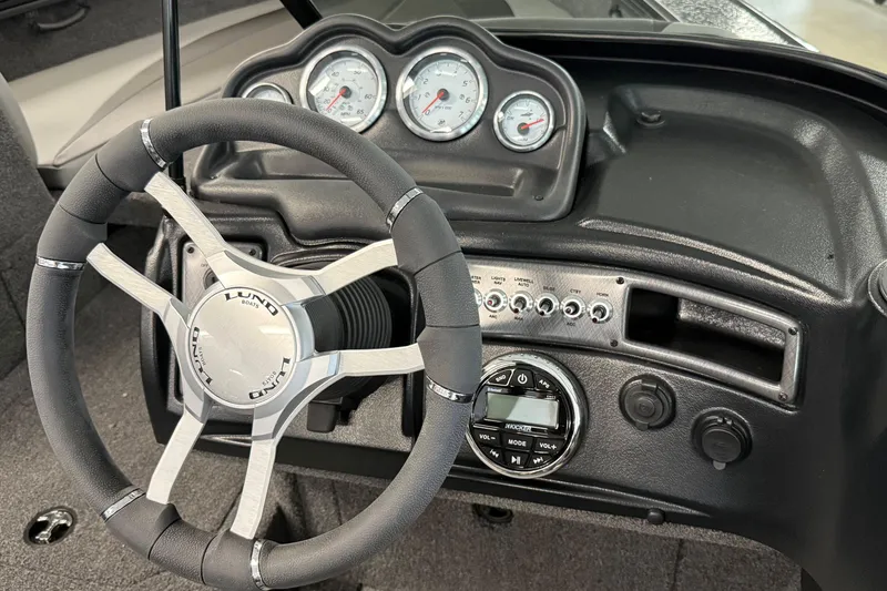 Slide: The Image of 2025 Lund 1875 Crossover XS dashboard with steering wheel and gauges. - 4