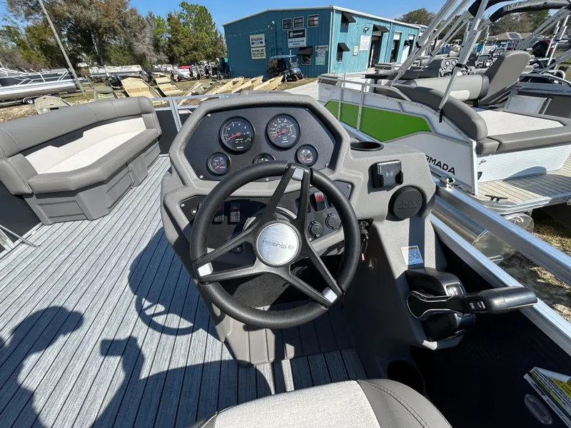 Slide: The Image of Steering console of 2025 Armada Saphir 21SB boat with modern controls and seating. - 11