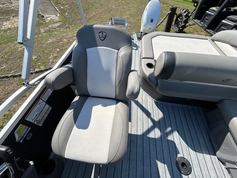 Slide: The Image of Armada Saphir 21SB 2025 boat interior with gray seating and deck flooring. - 12