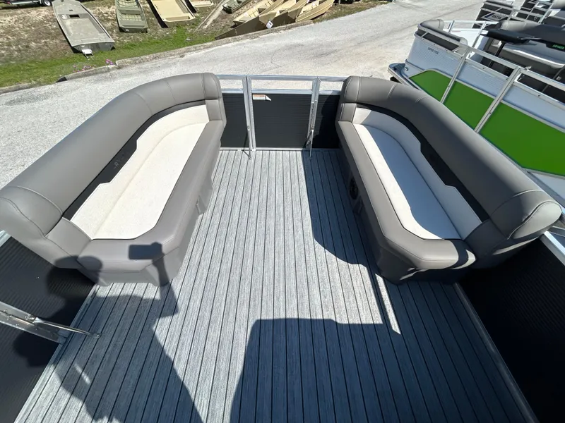 Slide: The Image of 2025 Armada Saphir 21SB boat interior with gray seating and wooden deck. - 6