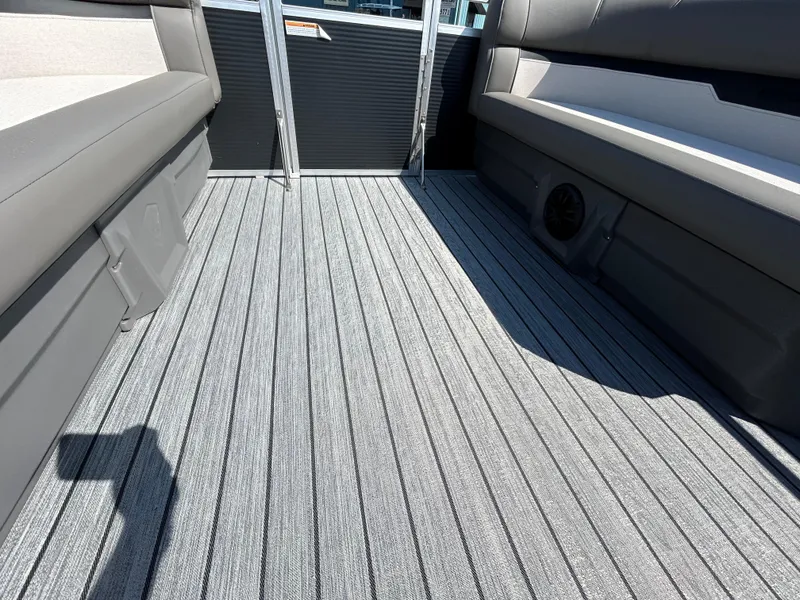 Slide: The Image of Interior view of 2025 Armada Saphir 21SB boat with sleek seating and textured flooring. - 7