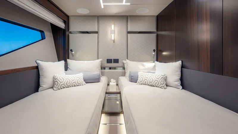 Slide: The Image of Luxurious twin cabin interior of 2025 Sunseeker 88 Yacht with modern design and plush bedding. - 26