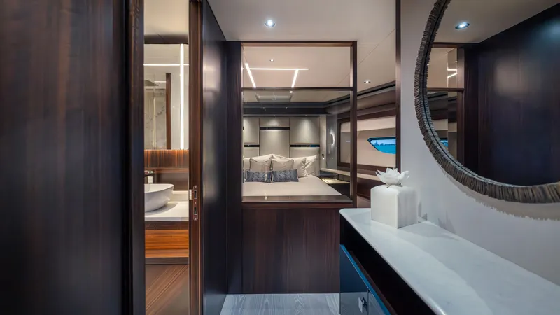 Slide: The Image of Luxurious interior of 2025 Sunseeker 88 Yacht, featuring elegant bedroom and bathroom design. - 34