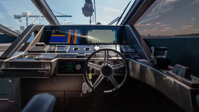 Slide: The Image of Cockpit of 2025 Sunseeker 88 Yacht with advanced navigation systems and sleek design. - 46