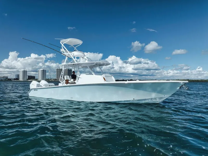 Slide: The Image of 2023 Jupiter 40 boat cruising on open water under a clear blue sky. - 10