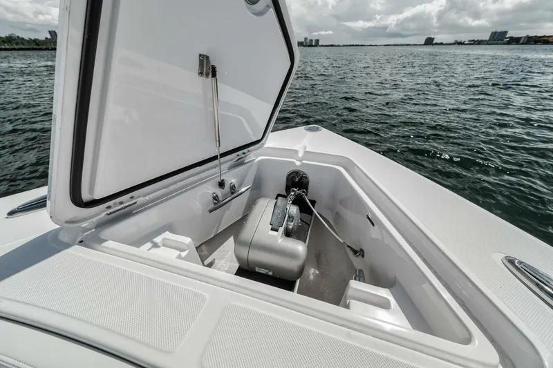 Slide: The Image of 2023 Jupiter 40 boat anchor compartment open on calm water. - 13