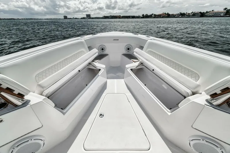 Slide: The Image of 2023 Jupiter 40 boat interior with white seating and ocean view. - 14