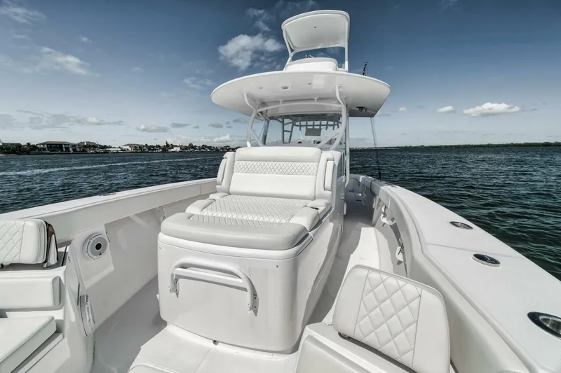Slide: The Image of 2023 Jupiter 40 boat with luxurious seating on open water. - 15