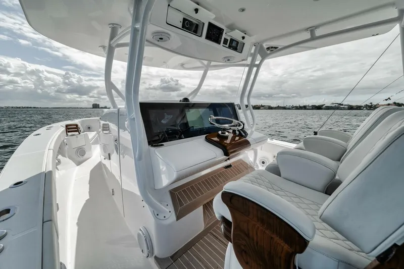 Slide: The Image of Interior view of 2023 Jupiter 40 boat, featuring modern helm and luxurious seating. - 25