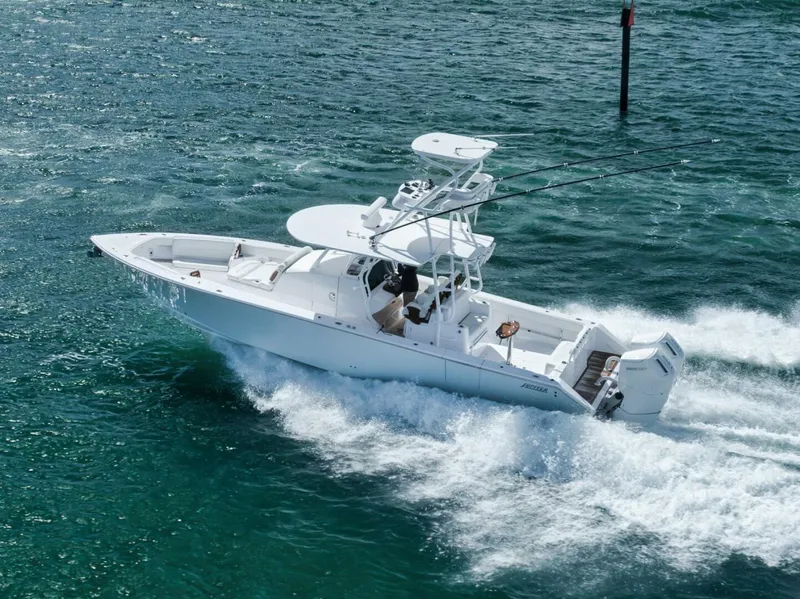 Slide: The Image of 2023 Jupiter 40 boat cruising on open water, showcasing sleek design and powerful performance. - 3