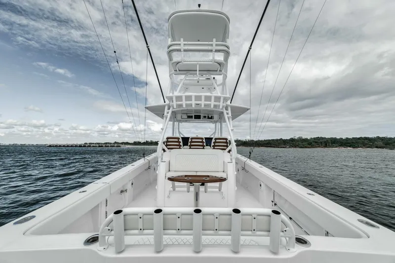 Slide: The Image of 2023 Jupiter 40 boat on water, showcasing spacious deck and seating. - 34