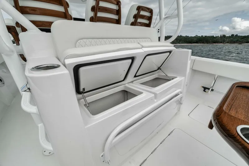 Slide: The Image of Jupiter 40 boat interior with open storage compartments, 2023 model. - 37