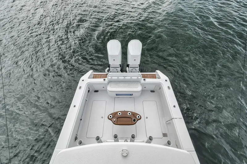 Slide: The Image of 2023 Jupiter 40 boat stern with dual engines on water. - 38