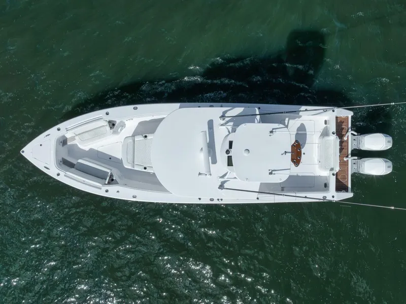 Slide: The Image of Aerial view of 2023 Jupiter 40 boat on water, showcasing sleek design and twin engines. - 49
