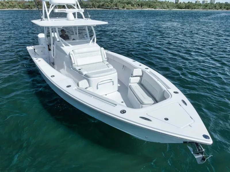 Slide: The Image of 2023 Jupiter 40 boat cruising on clear blue water. - 8