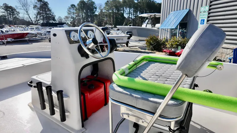 Slide: The Image of 2025 Carolina Skiff EV180 Sea Skiff interior with steering console and seating. - 10