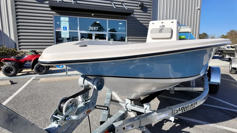 Slide: The Image of 2025 Carolina Skiff EV180 Sea Skiff on trailer outside dealership. - 6