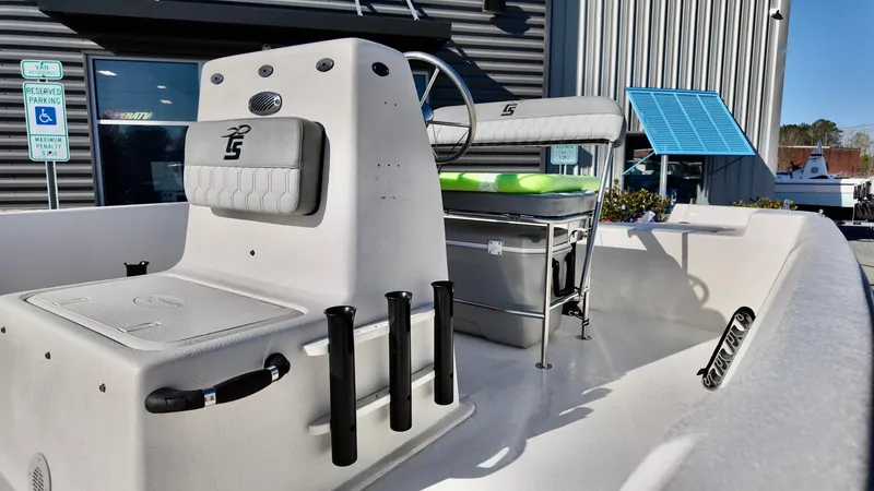 Slide: The Image of 2025 Carolina Skiff EV180 Sea Skiff interior with seating and steering console. - 9