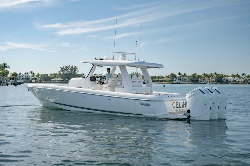 Slide: The Image of 2023 Intrepid 427 Nomad SE boat cruising on calm waters. - 1