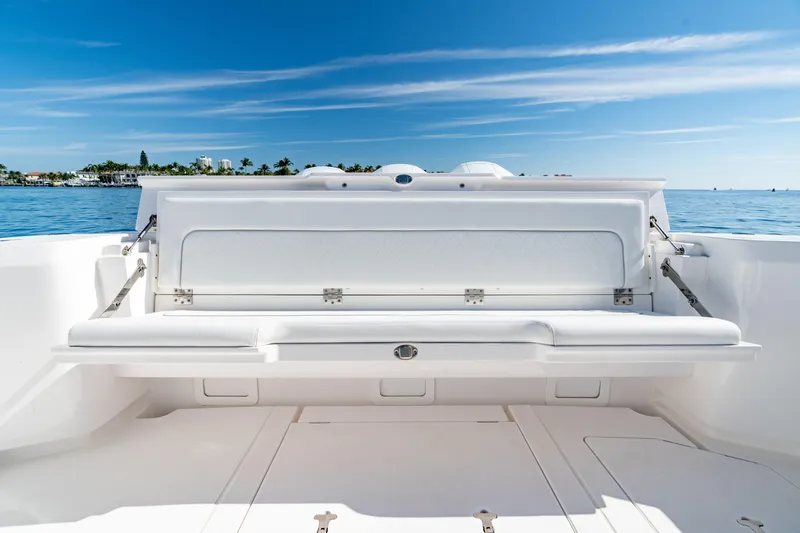 Slide: The Image of 2023 Intrepid 427 Nomad SE boat interior with open storage compartment. - 19
