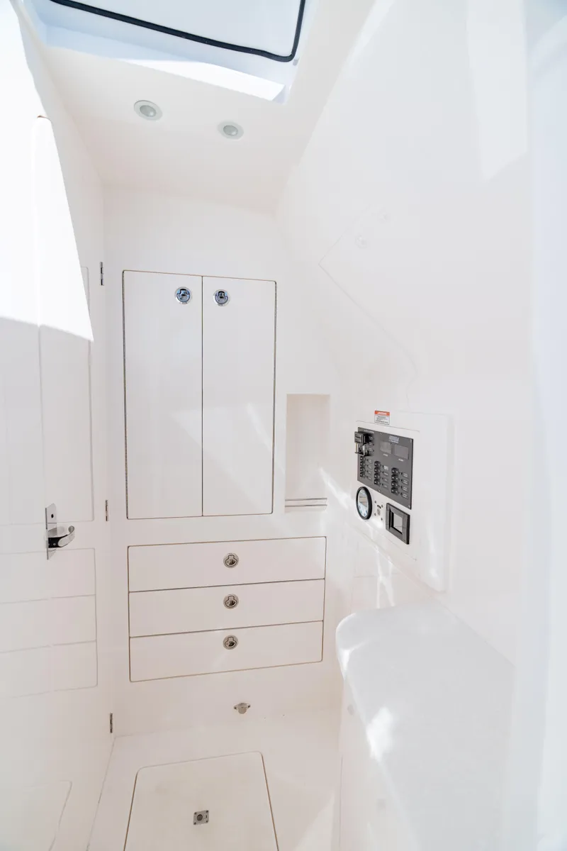 Slide: The Image of 2023 Intrepid 427 Nomad SE interior cabin with white cabinetry and modern design. - 23