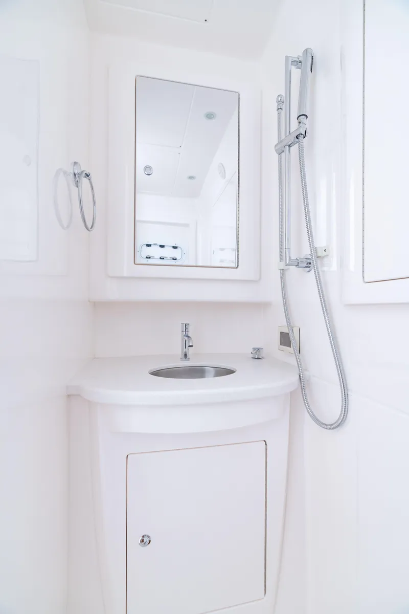 Slide: The Image of 2023 Intrepid 427 Nomad SE bathroom with sleek white design and modern fixtures. - 25