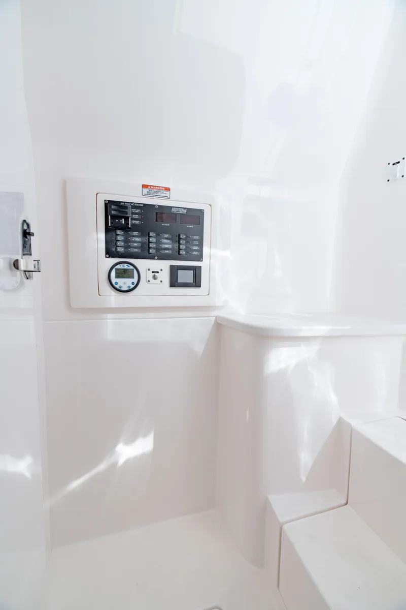 Slide: The Image of 2023 Intrepid 427 Nomad SE interior control panel with sleek white design. - 26