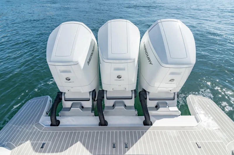 Slide: The Image of 2023 Intrepid 427 Nomad SE with triple Mercury outboard engines on water. - 28