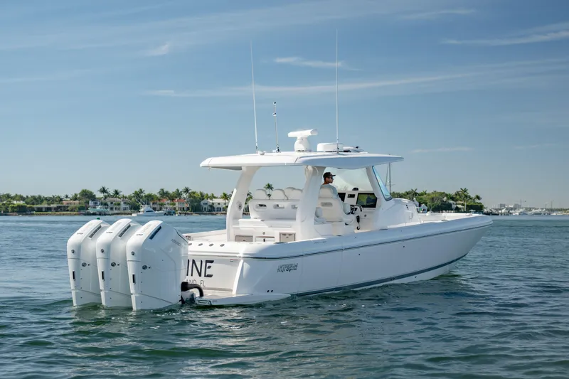 Slide: The Image of 2023 Intrepid 427 Nomad SE boat cruising on calm waters. - 4