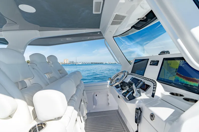 Slide: The Image of 2023 Intrepid 427 Nomad SE boat interior with advanced navigation system and ocean view. - 9