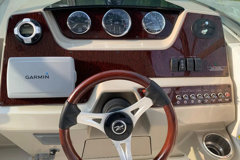 Slide: The Image of Control panel of a 2010 Sea Ray 260 Sundancer boat with Garmin navigation. - 33