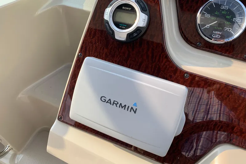 Slide: The Image of Dashboard of 2010 Sea Ray 260 Sundancer with Garmin and Sony equipment. - 37