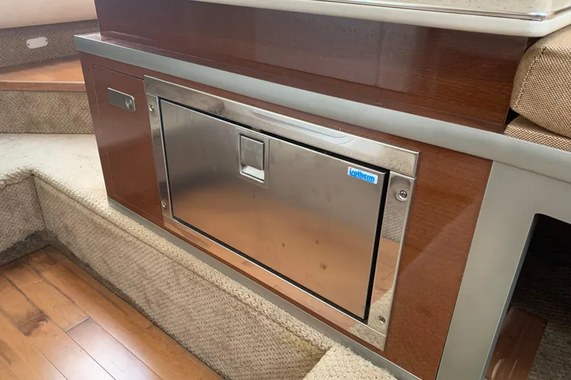 Slide: The Image of Interior of 2010 Sea Ray 260 Sundancer with built-in stainless steel fridge. - 46